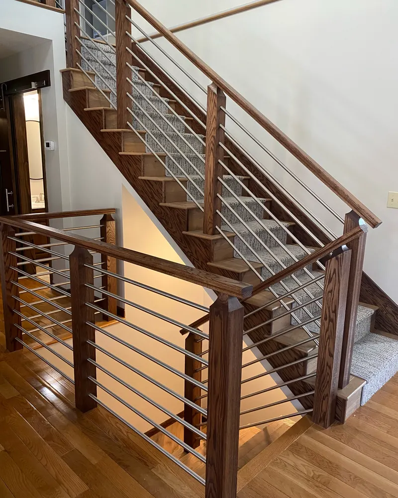 Patterned carpet runner on oak stairs