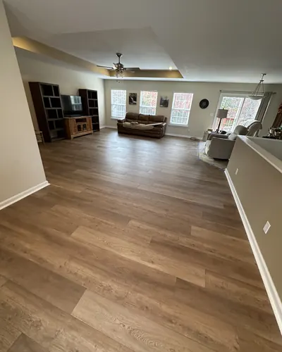 Wood-look vinyl plank running through an open living room